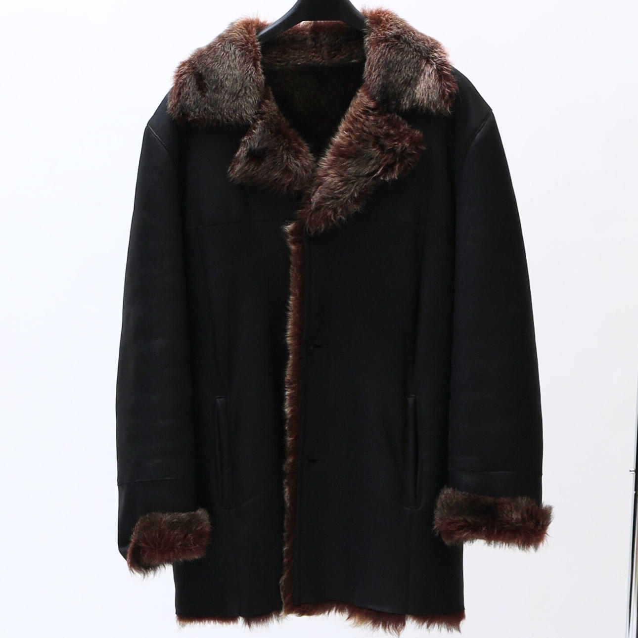 Leather coat, with inner fur lining.