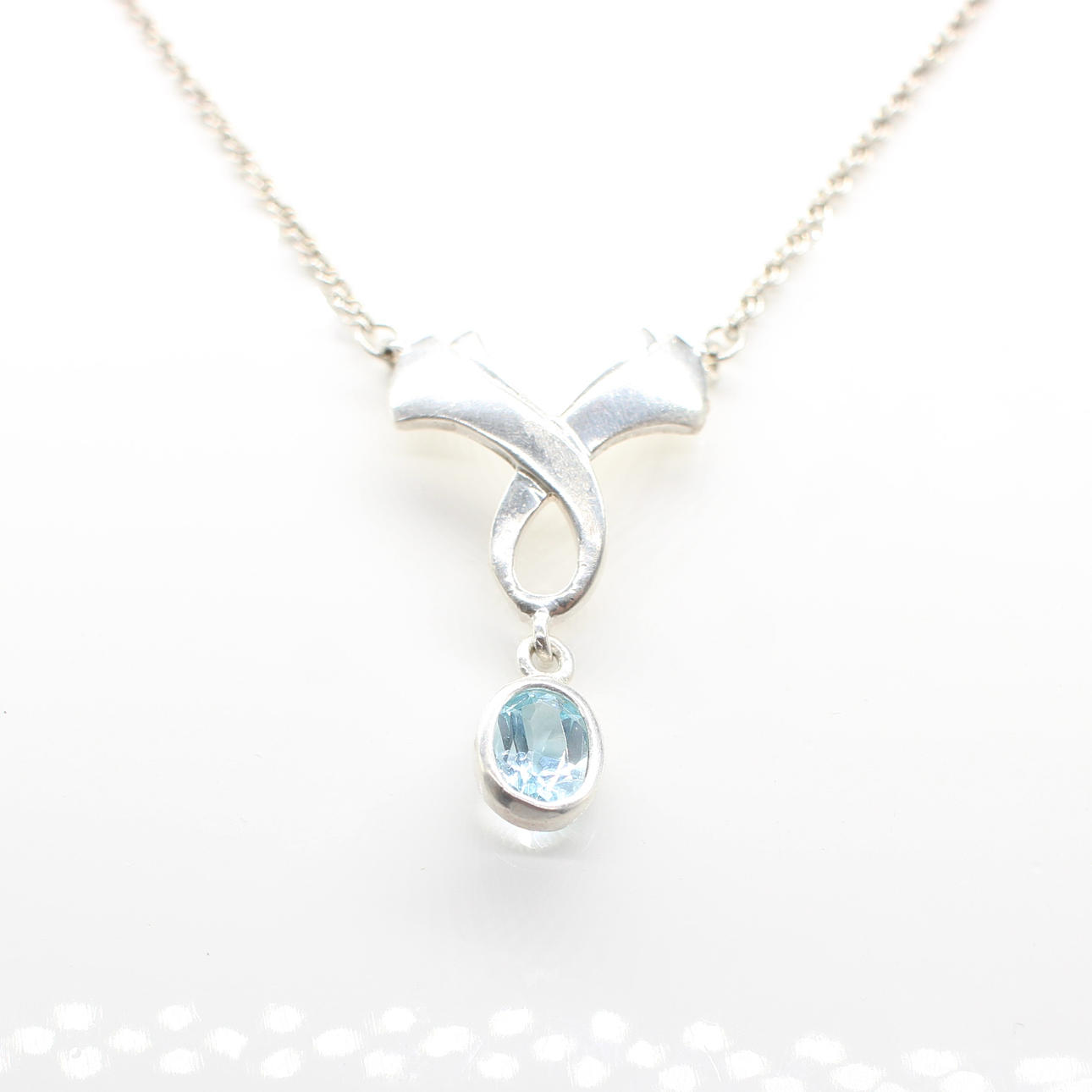 SILVER & BLUE STONE NECKLACE.