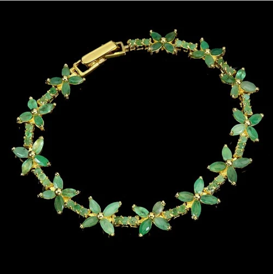 SILVER GILT EMERALD BRACELET.