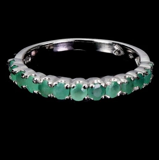 EMERALD SILVER HALF ETERNITY RING.