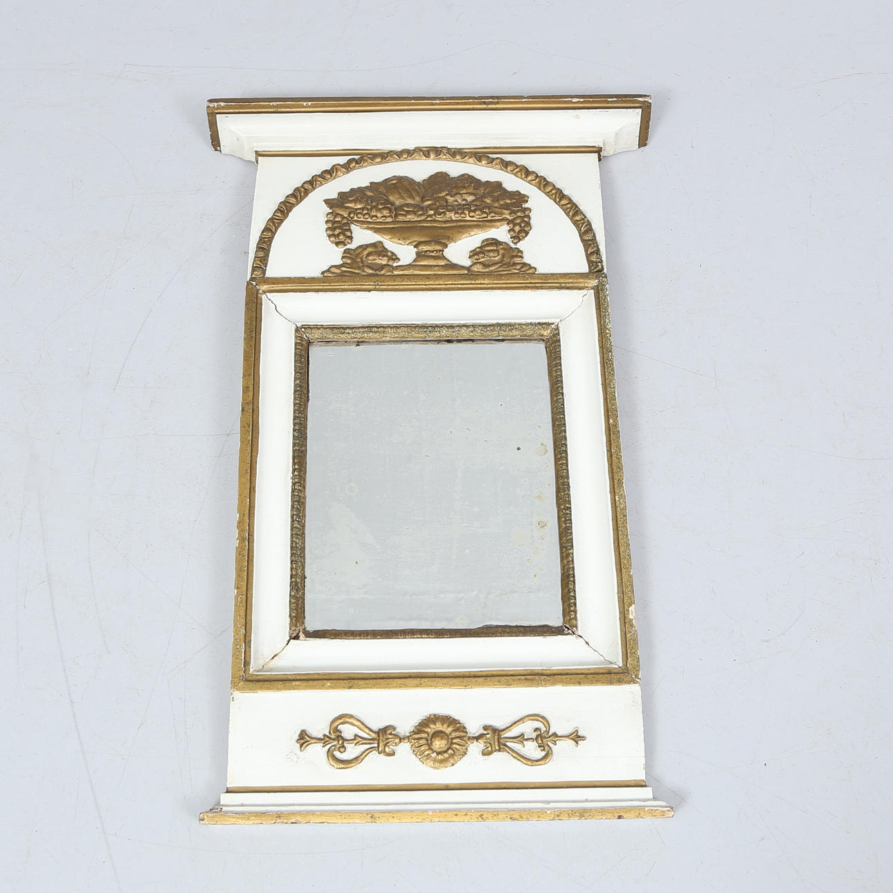 An empire mirror, 19th century.