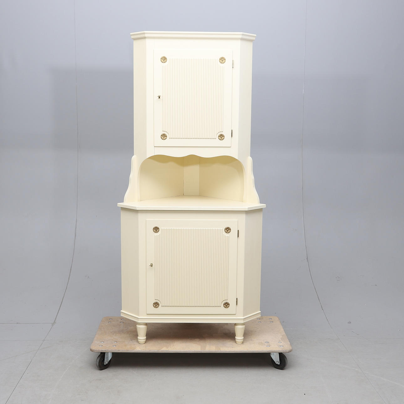 A Gustavian style corner cabinet, 20th century.