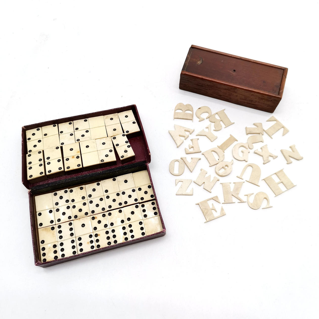 ANTIQUE CARVED BONE ALPHABET IN BOX.