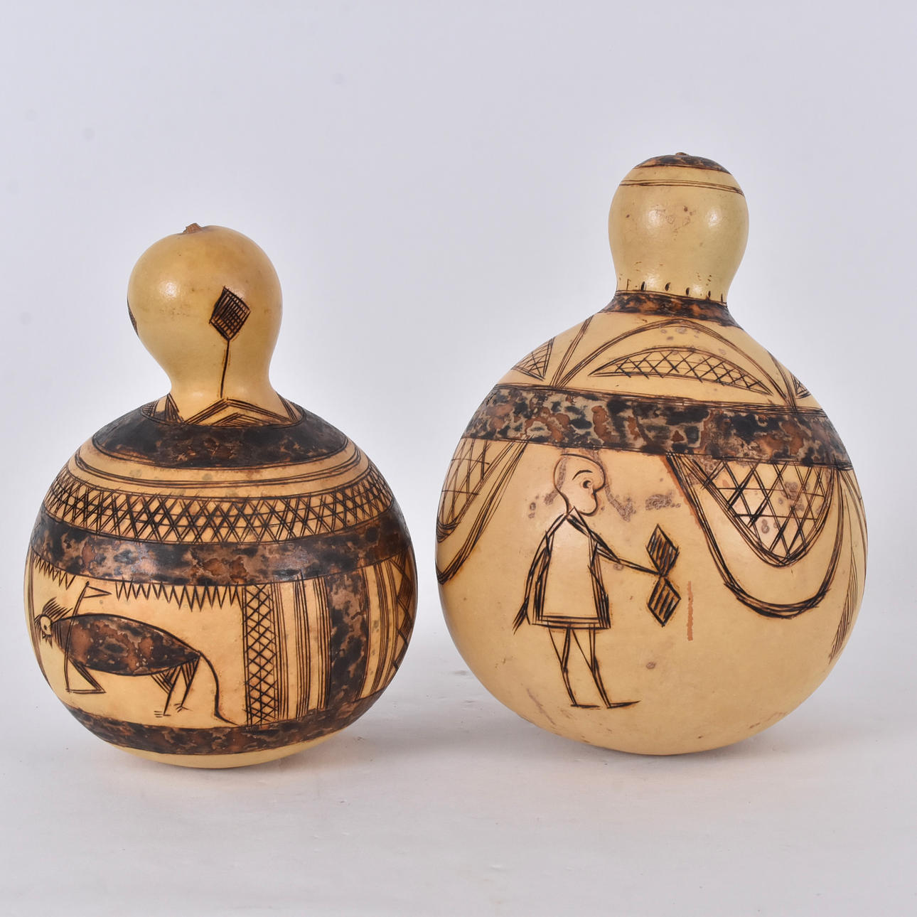 GOURDS, 2 pieces, cut wood, West Africa.