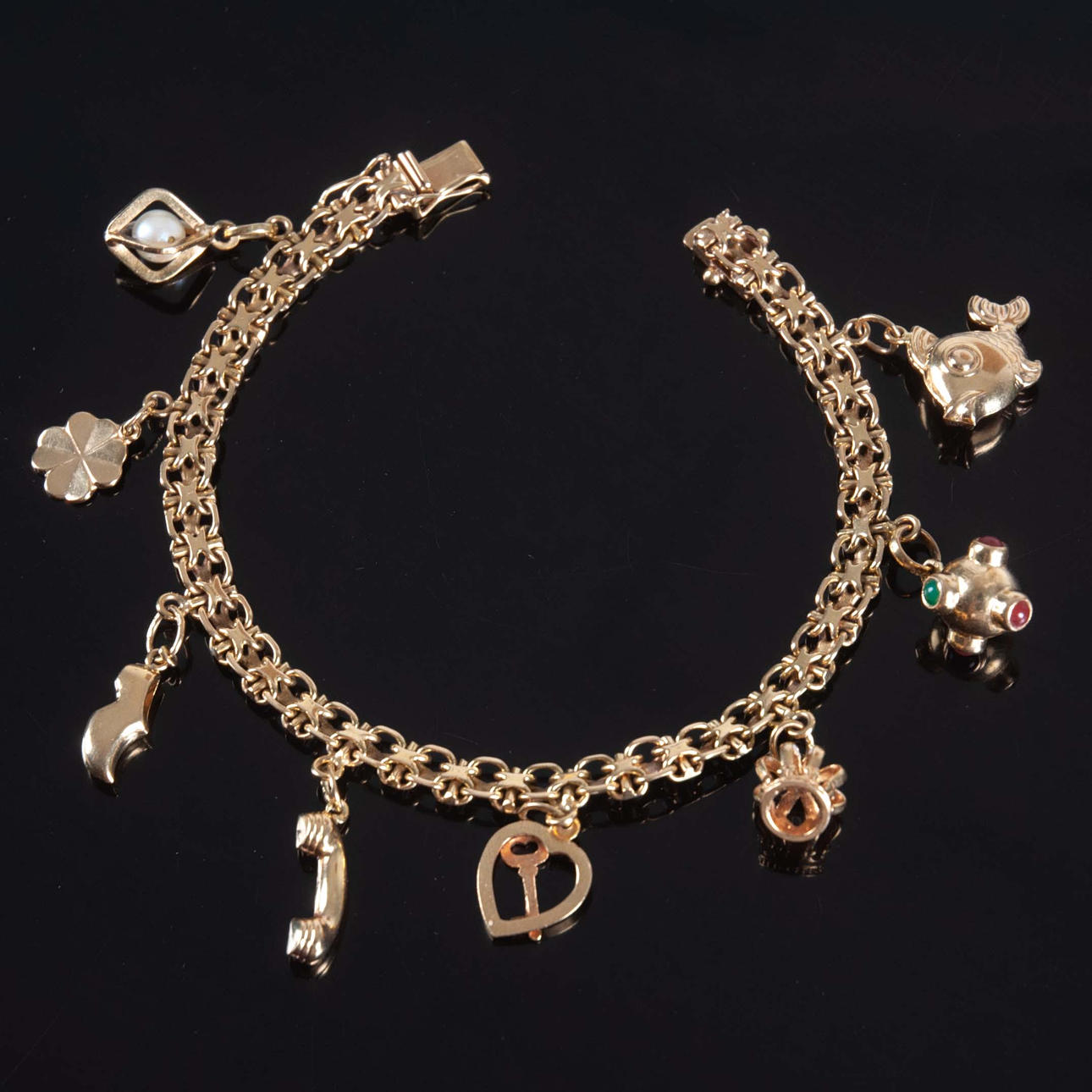 BERLOCKARMBAND 18 k guld 20,17 g.