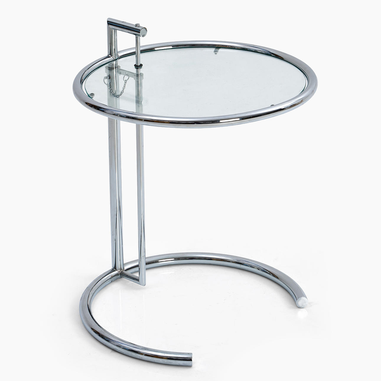 EILEEN GREY. Side table, model E1027, ClassIcon, designed 1927, chromed metal frame, glass top, adjustable height.