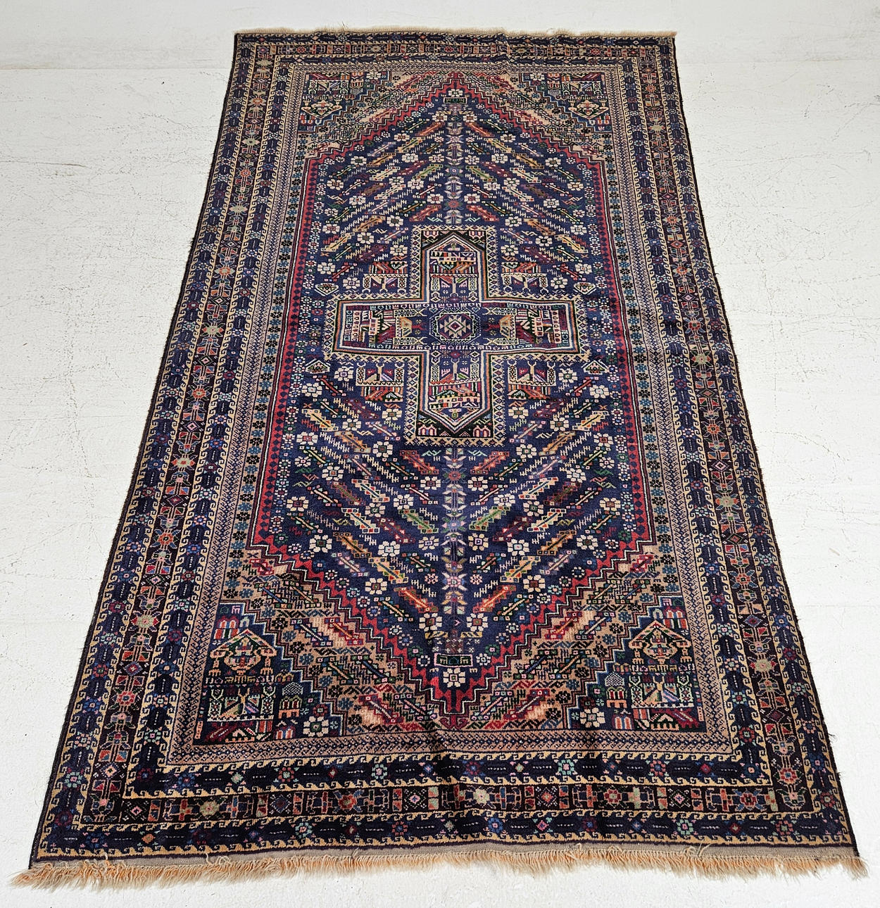An oriental rug, approx. 230x130 cm.
