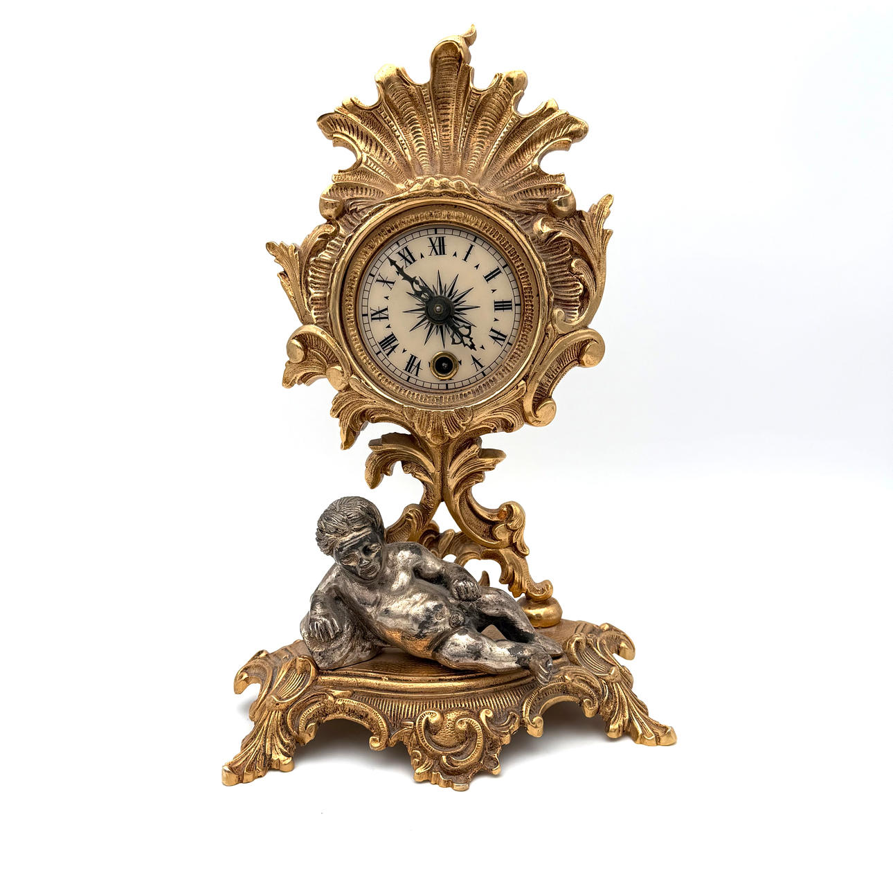 A 20th century rococo style table clock.
