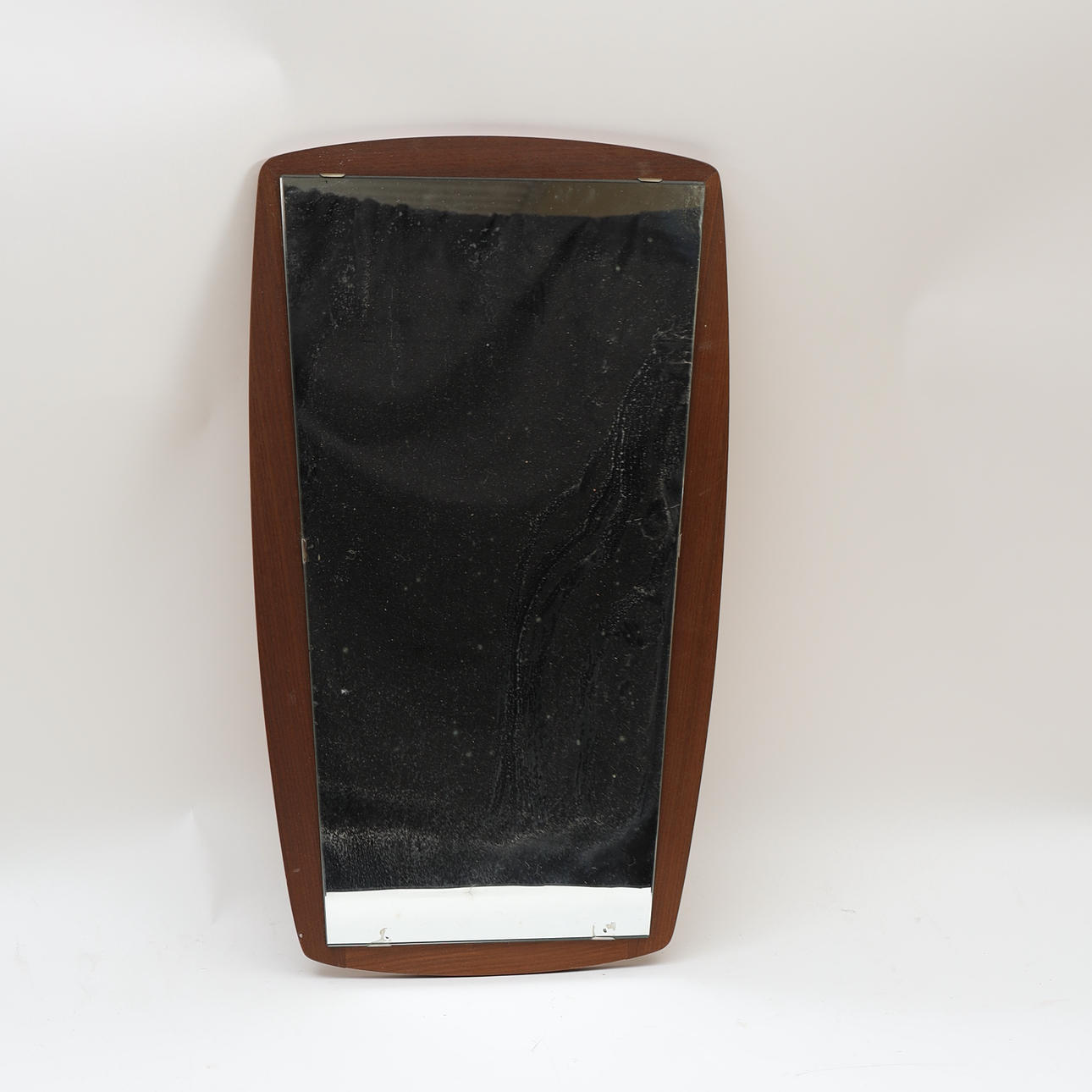 A 1950s/1960s teak mirror.