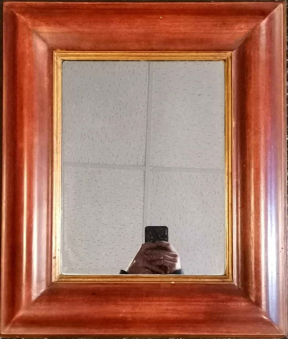 WOODEN CUSHION FRAMED WALL MIRROR.