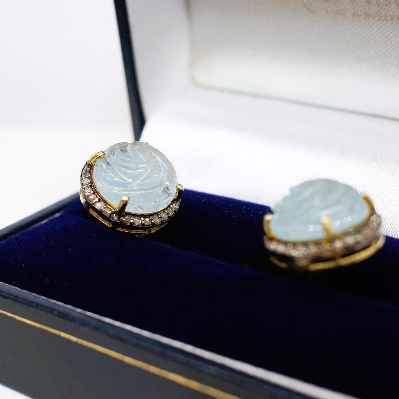HARDCARVED AQUAMARINE CUFFLINKS.