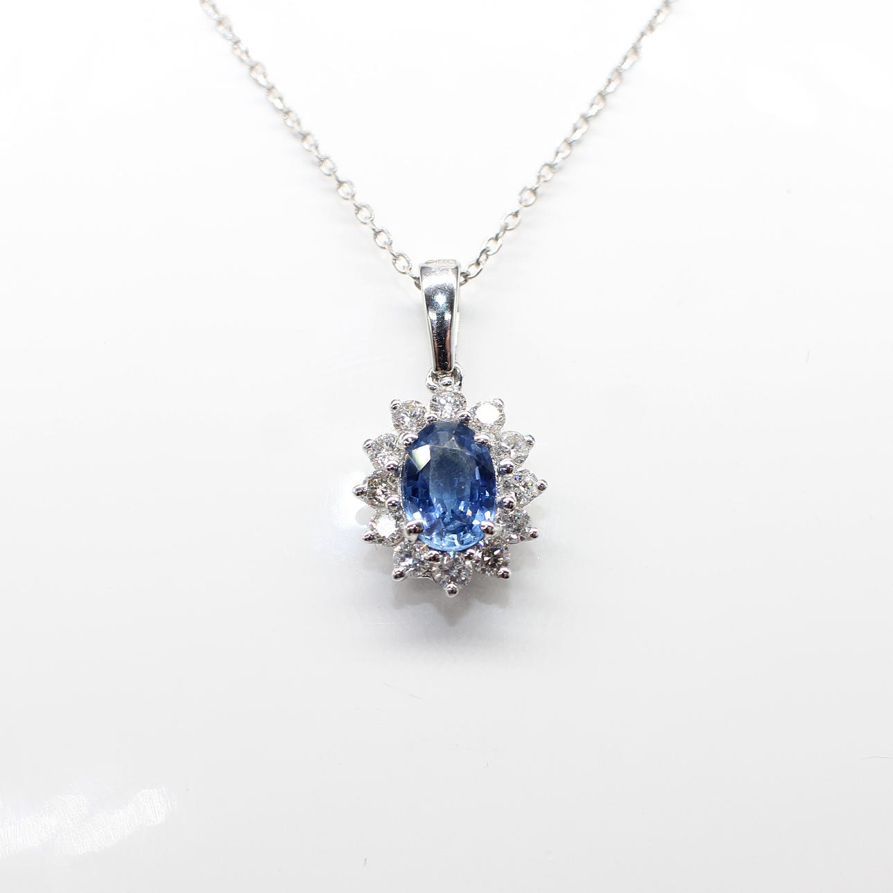 SAPPHIRE & DIAMOND CLUSTER NECKLACE.