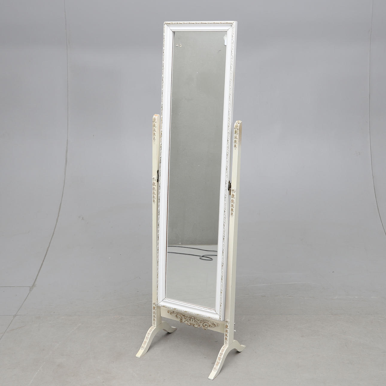 A mid-20th century floor mirror.