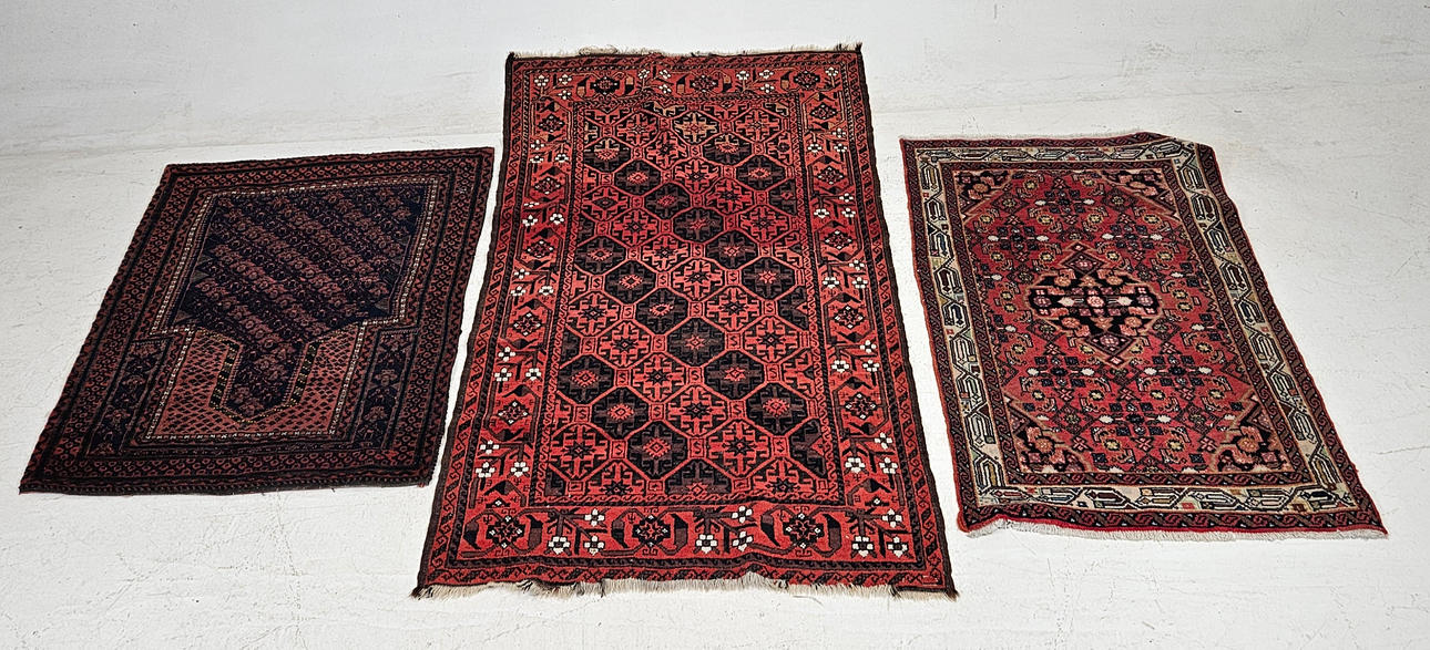 THREE ORIENTAL RUGS.