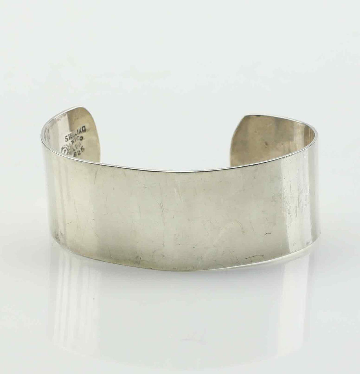 A sterling silver bangle, 1950s/60s.