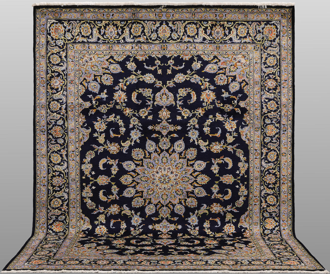 A CARPET, “Keshan”, signed, 350 x 248 cm.