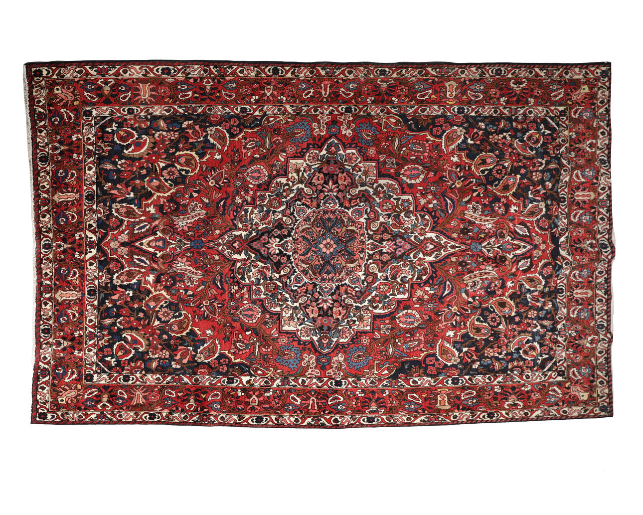 A PERSIAN KASHAN CARPET.