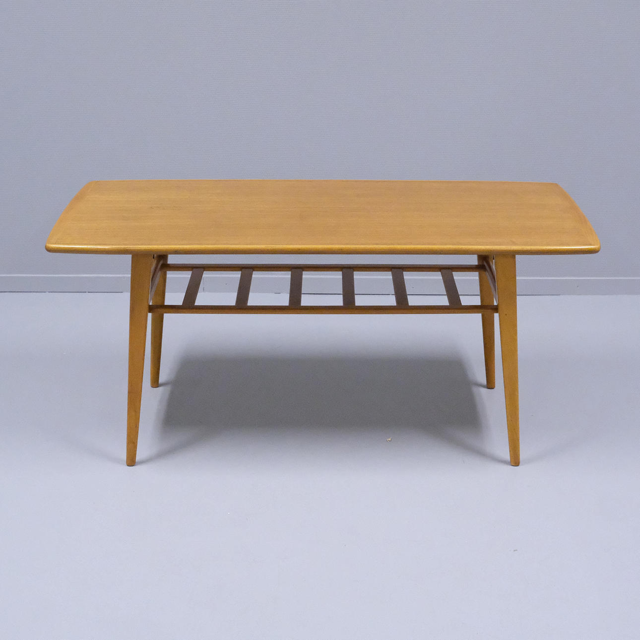 COFFEE TABLE WITH MAGAZINE SHELF. BOOK. 1950S.