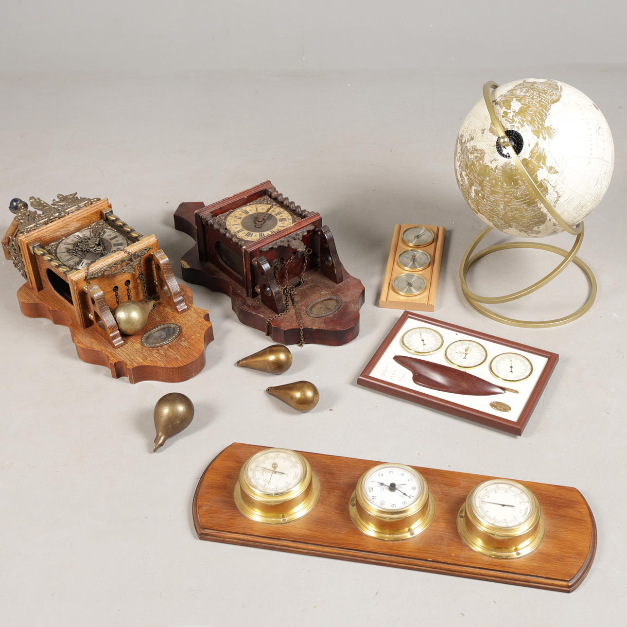 TWO WALL CLOCKS, THREE WEATHER STATIONS AND A GLOBE (6).