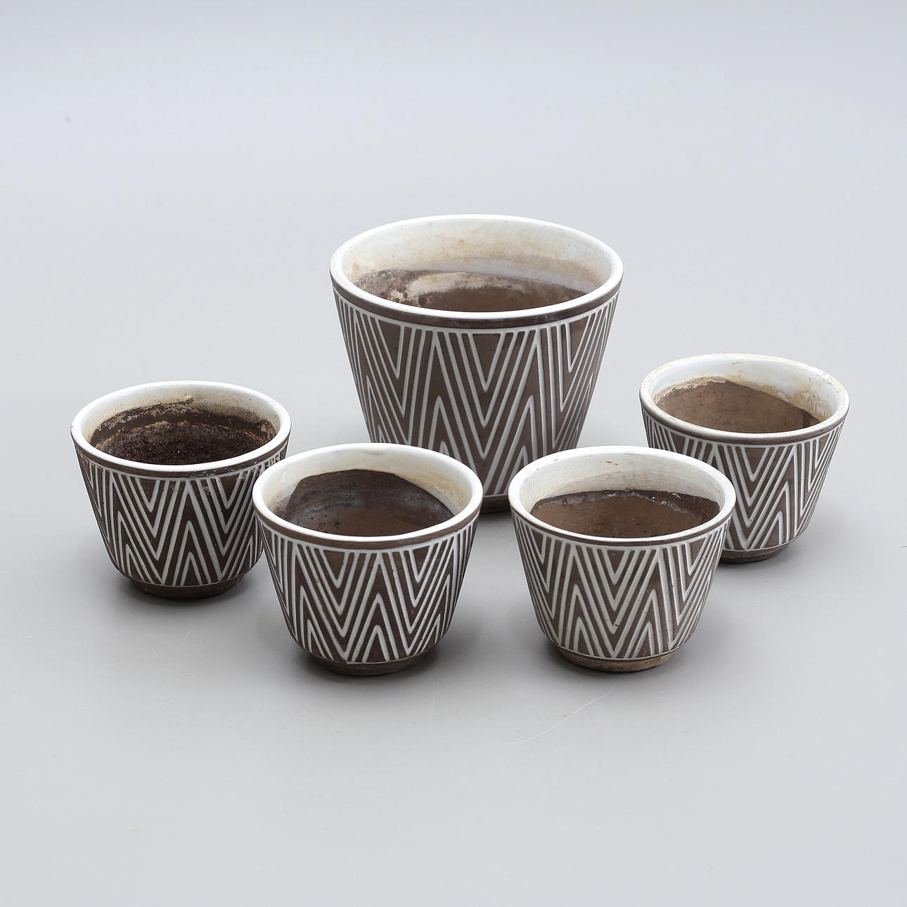 A set of 5 “Risto” earthenware outer liners, Upsala Ekeby.