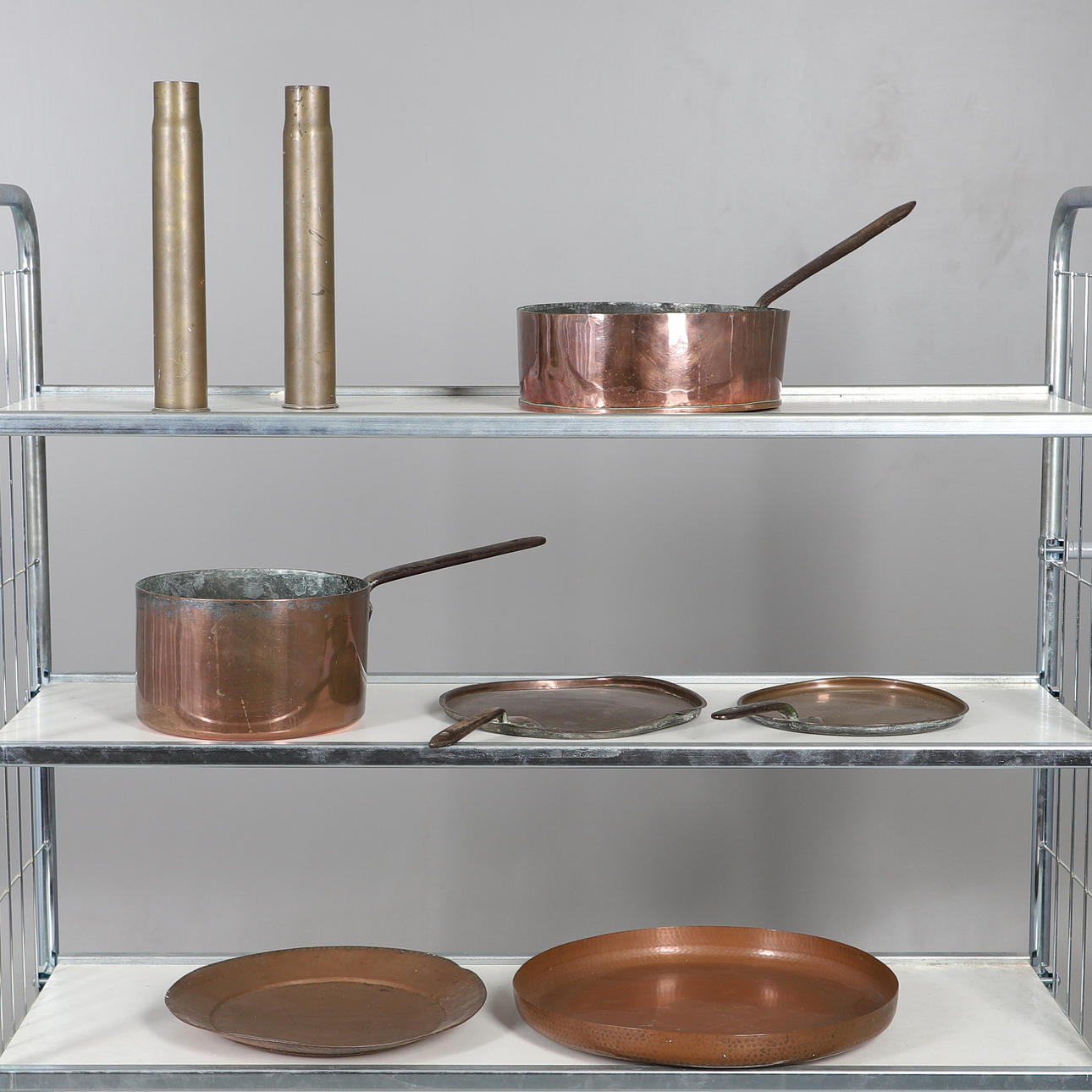 TWO VICTORIAN COPPER PANS AND COVERS, TWO BOWLS, TWO BRASS SHELL CASES.