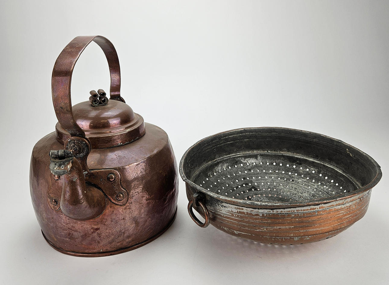 A strainer and coffee pot, 19th century.