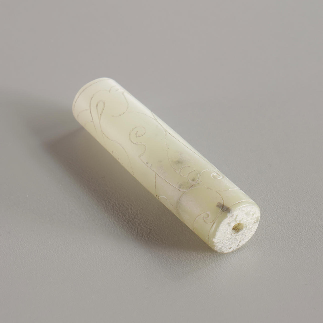 Chinese jade with carvings, through-hole.