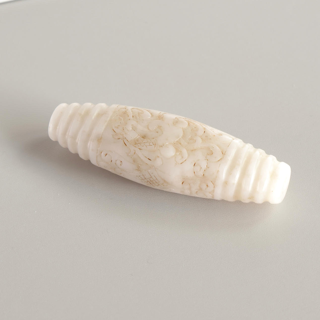 Chinese jade with carvings, through-hole.