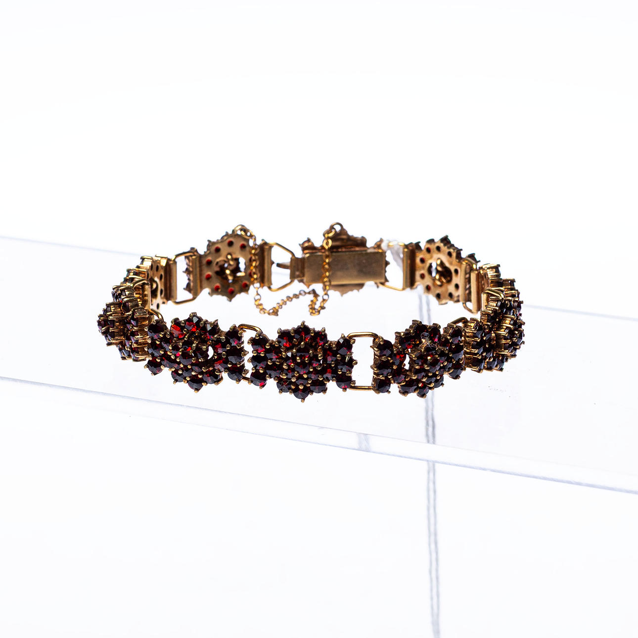 BRACELET, gilt silver with garnets.