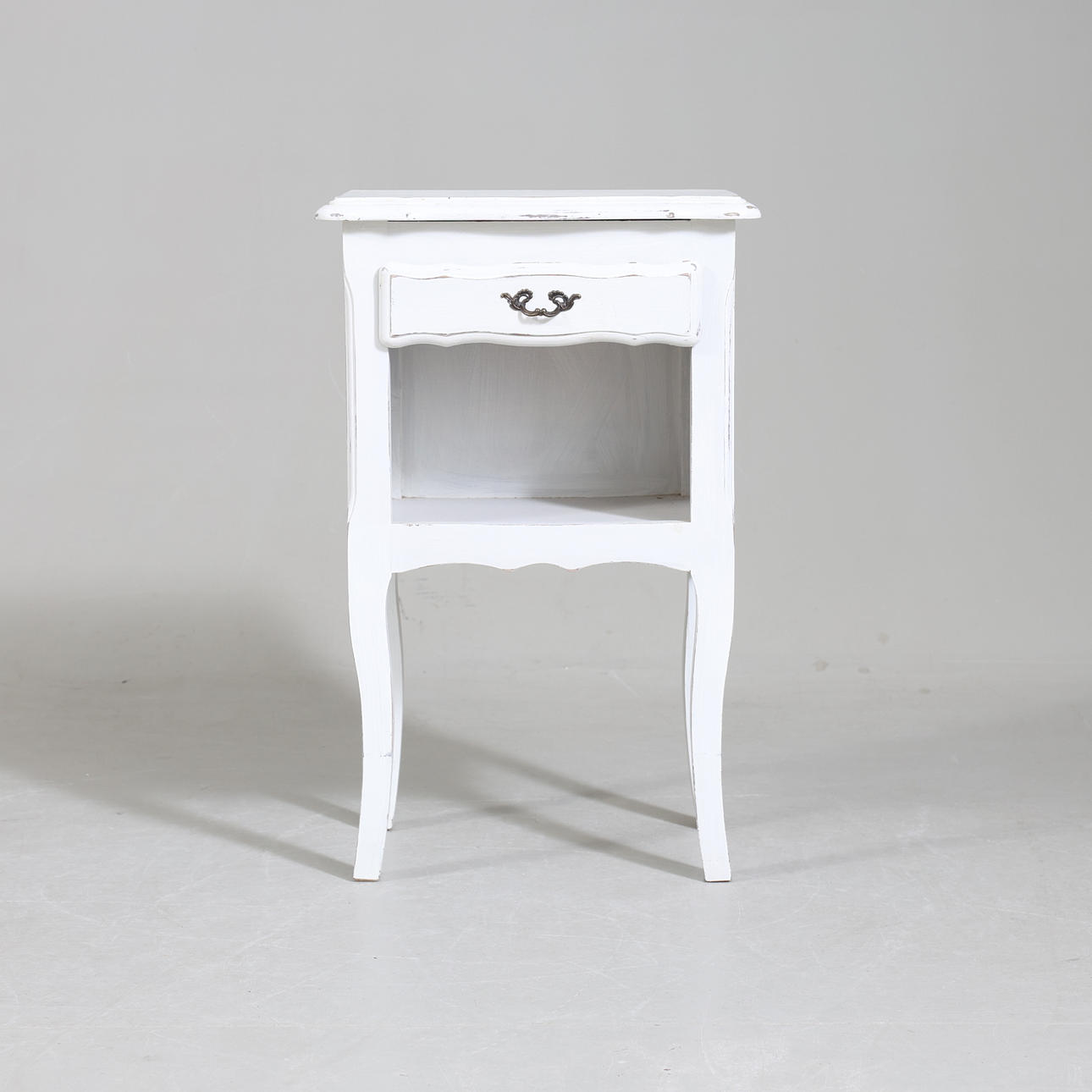 A bedside table, painted wood, 20th century.