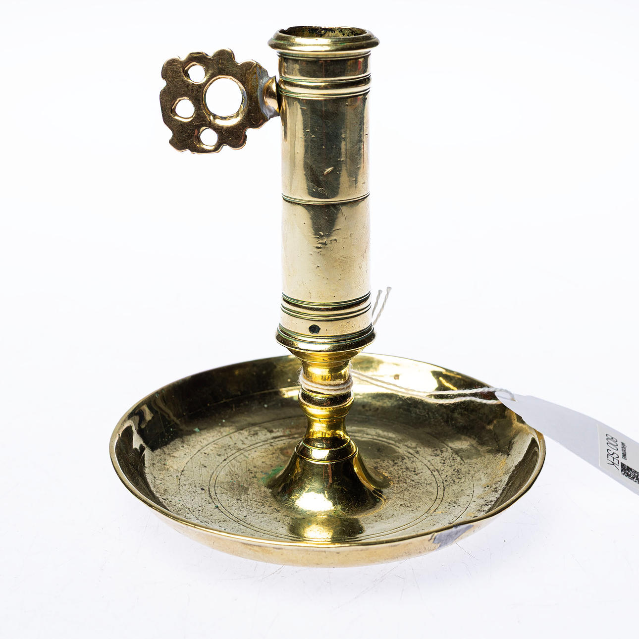 A brass candlestick, 18th century.
