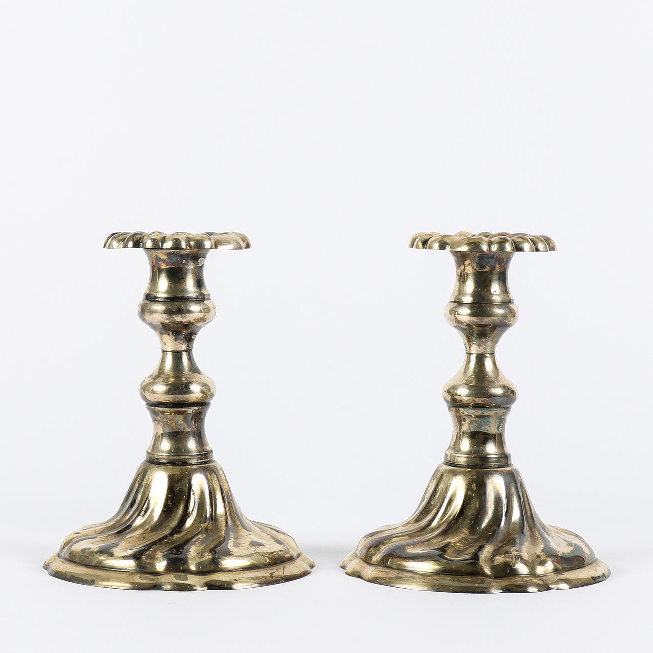 A pair of candlesticks, nickel silver.