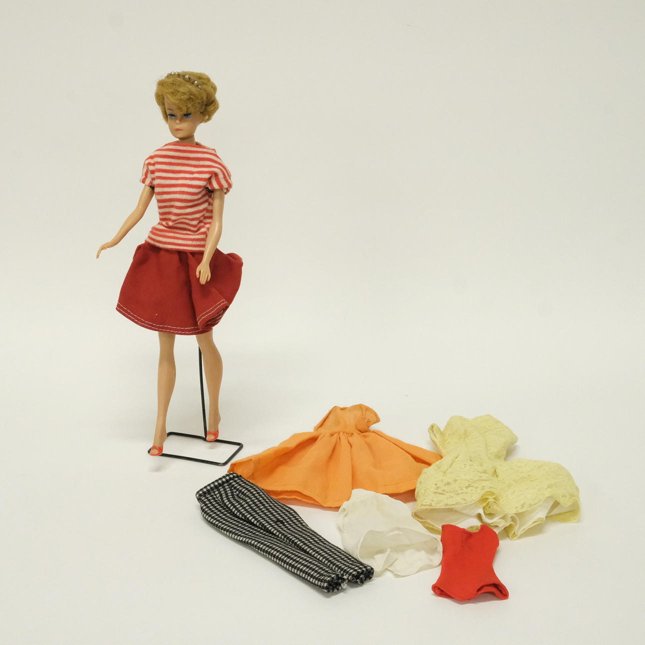 DOLL, BARBIE AS WELL AS CLOTHES.