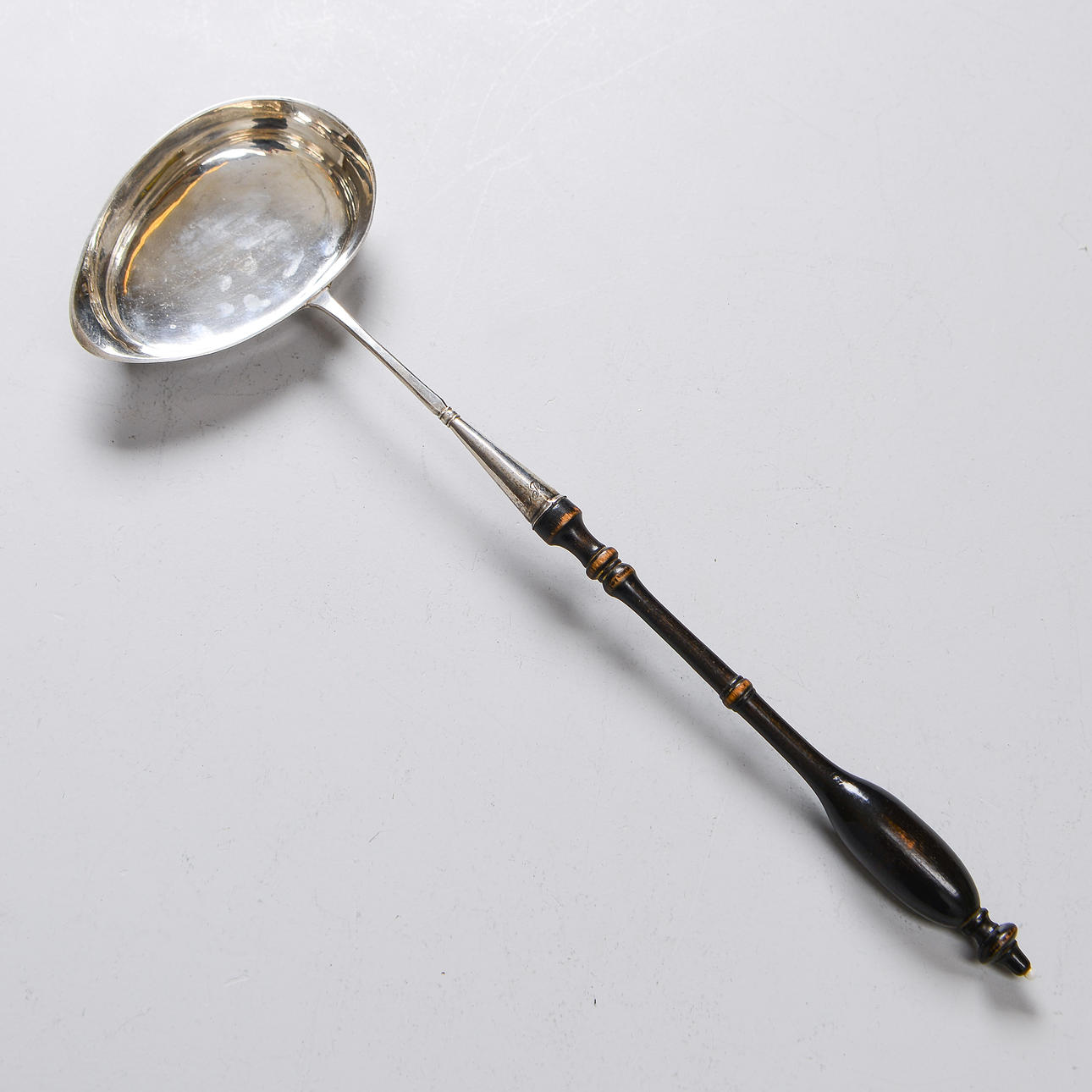 A silver soup ladle, IHS, 19th century.