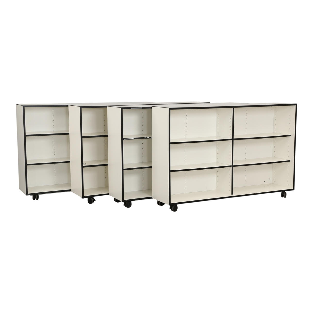 PAUSTIAN. Four racks on wheels (4).