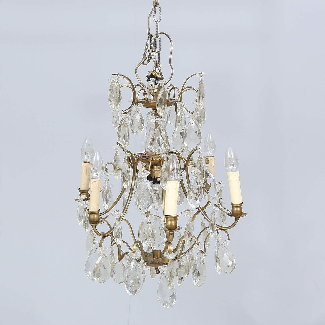 A 20th-century rococo ceiling chandelier with prisms.