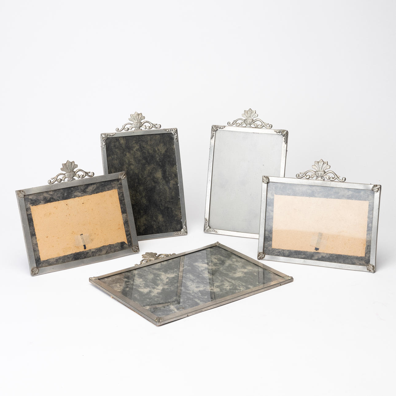 A set of 2+2 table frames and a 1920's pewter frame.