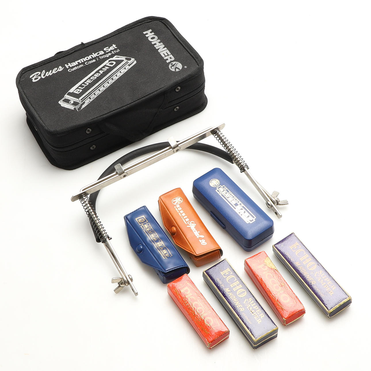 A set of 14 Hohner harmonicas.