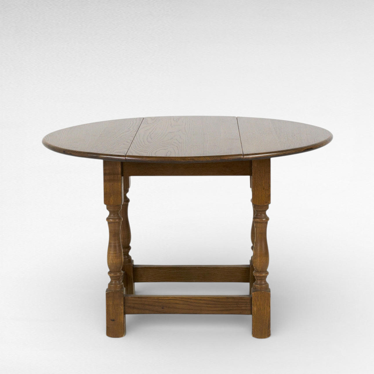 A 20th century oak side table with two folding flaps.