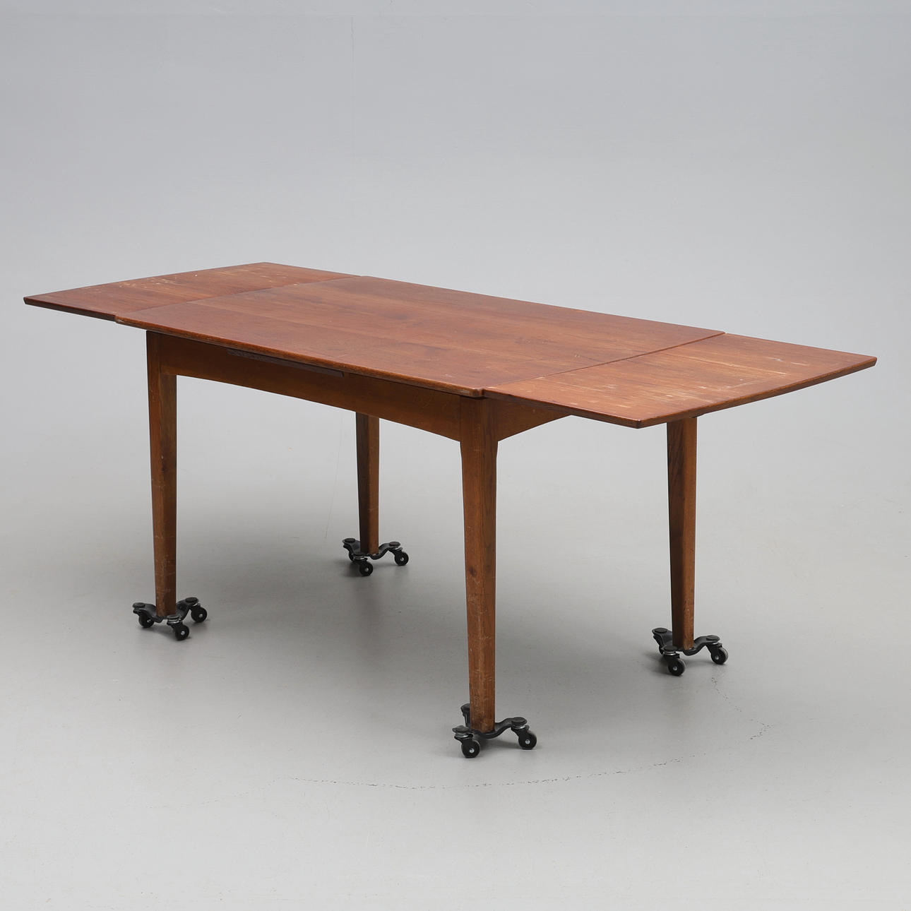 KITCHEN TABLE. Teak with extendable discs.