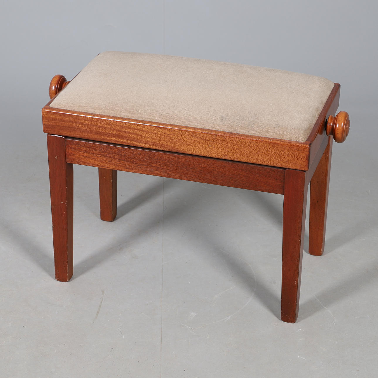 A MODERN OAK PIANO STOOL.