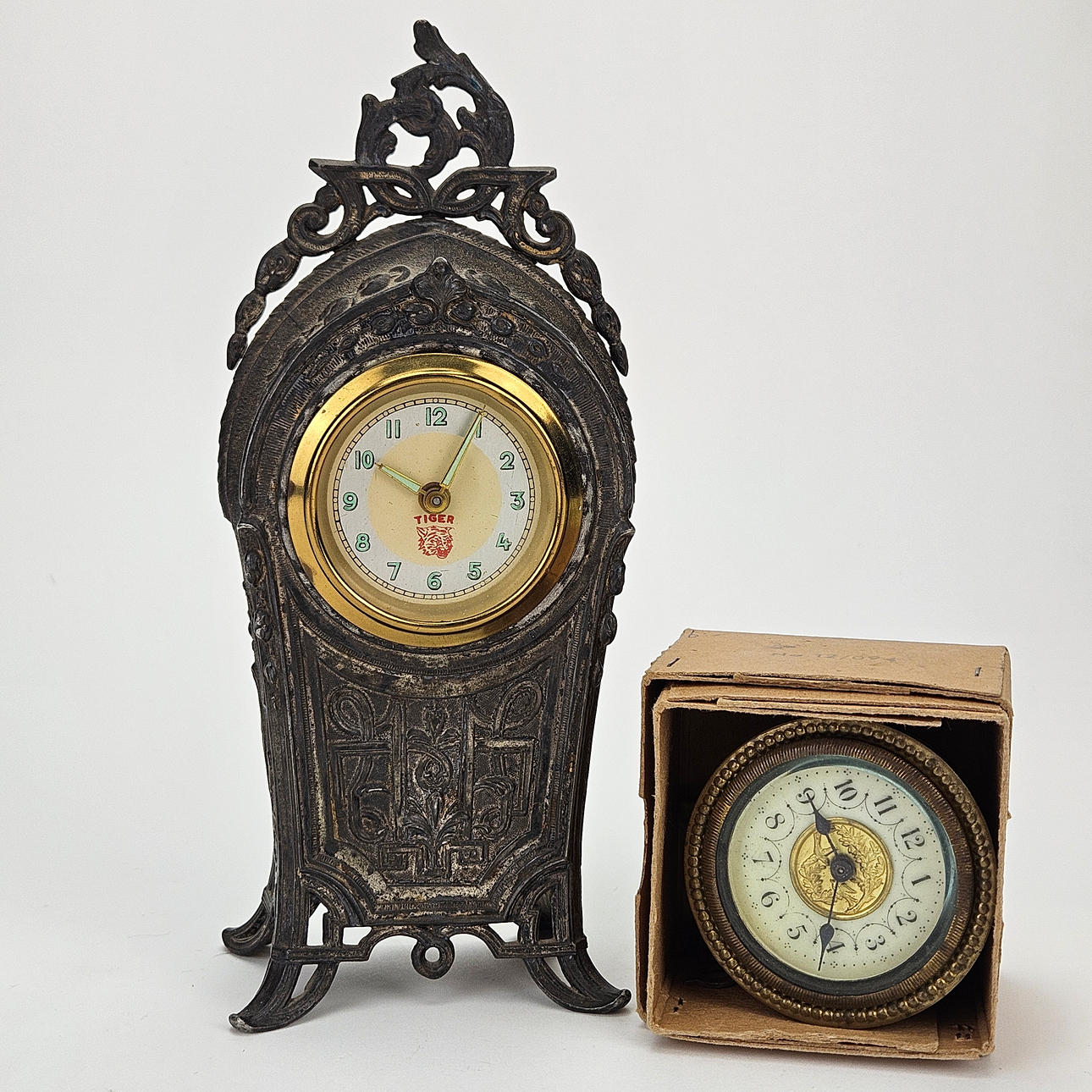 A metal table clock, circa 1900.