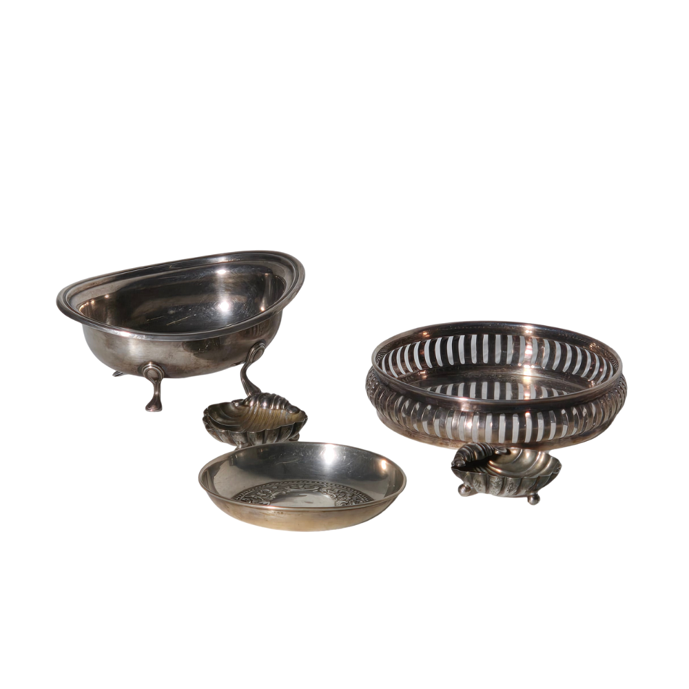 FOUR PUNCHED SILVER TRAYS.