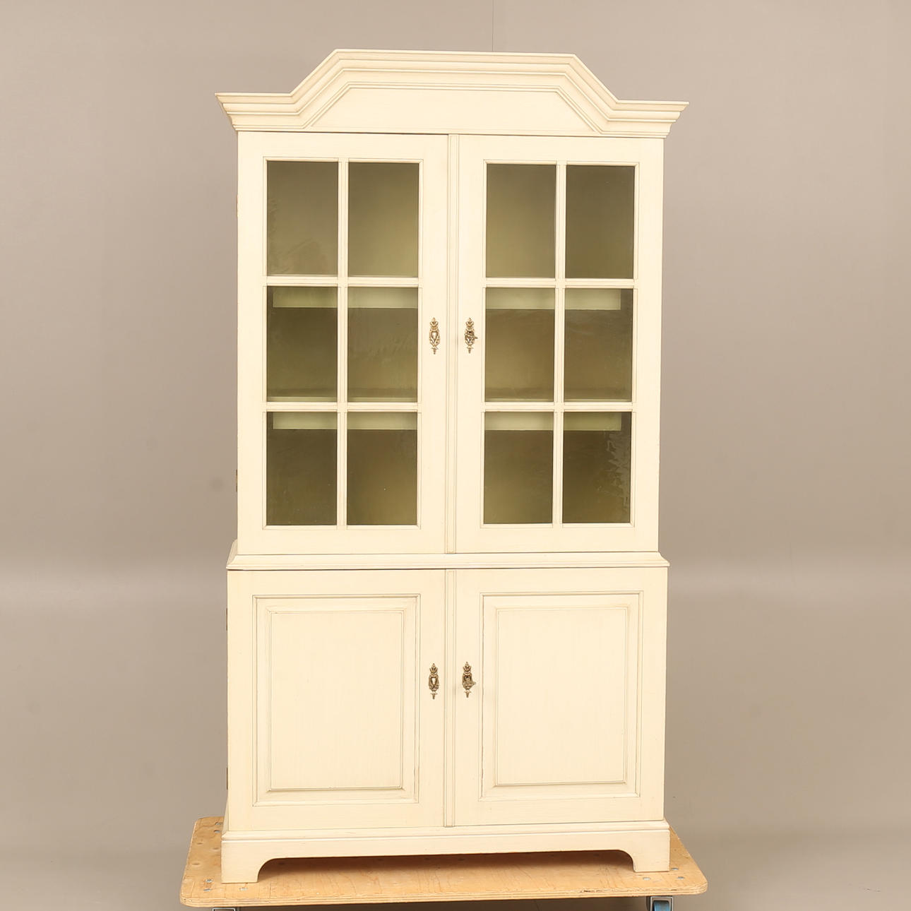 A 20th-century Åmells display cabinet.