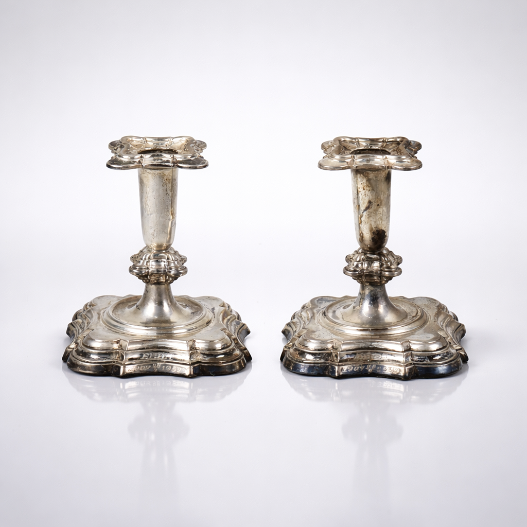 A pair of silver rococo candlesticks, mid 20th century.
