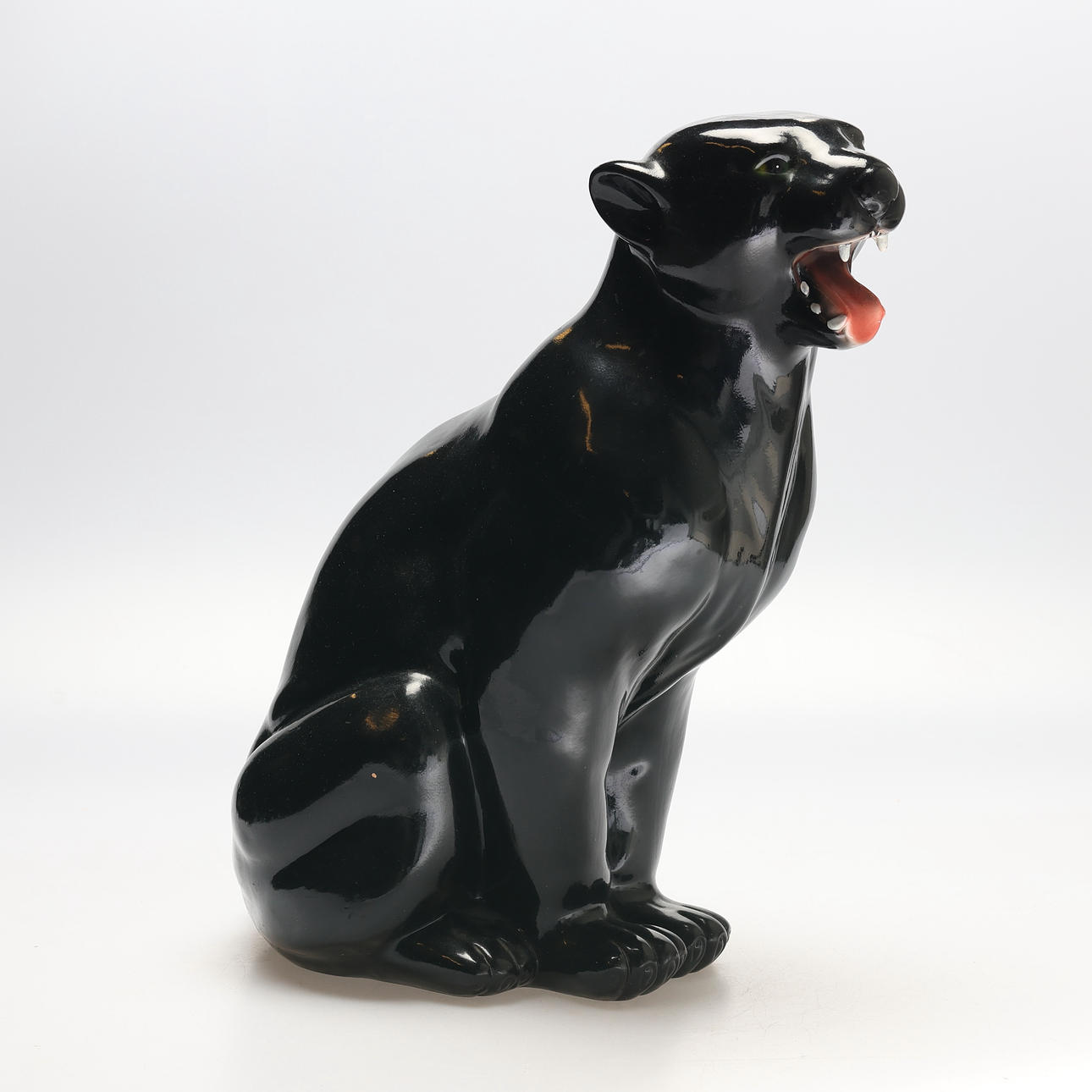A 20th century ceramic panther floor figure.