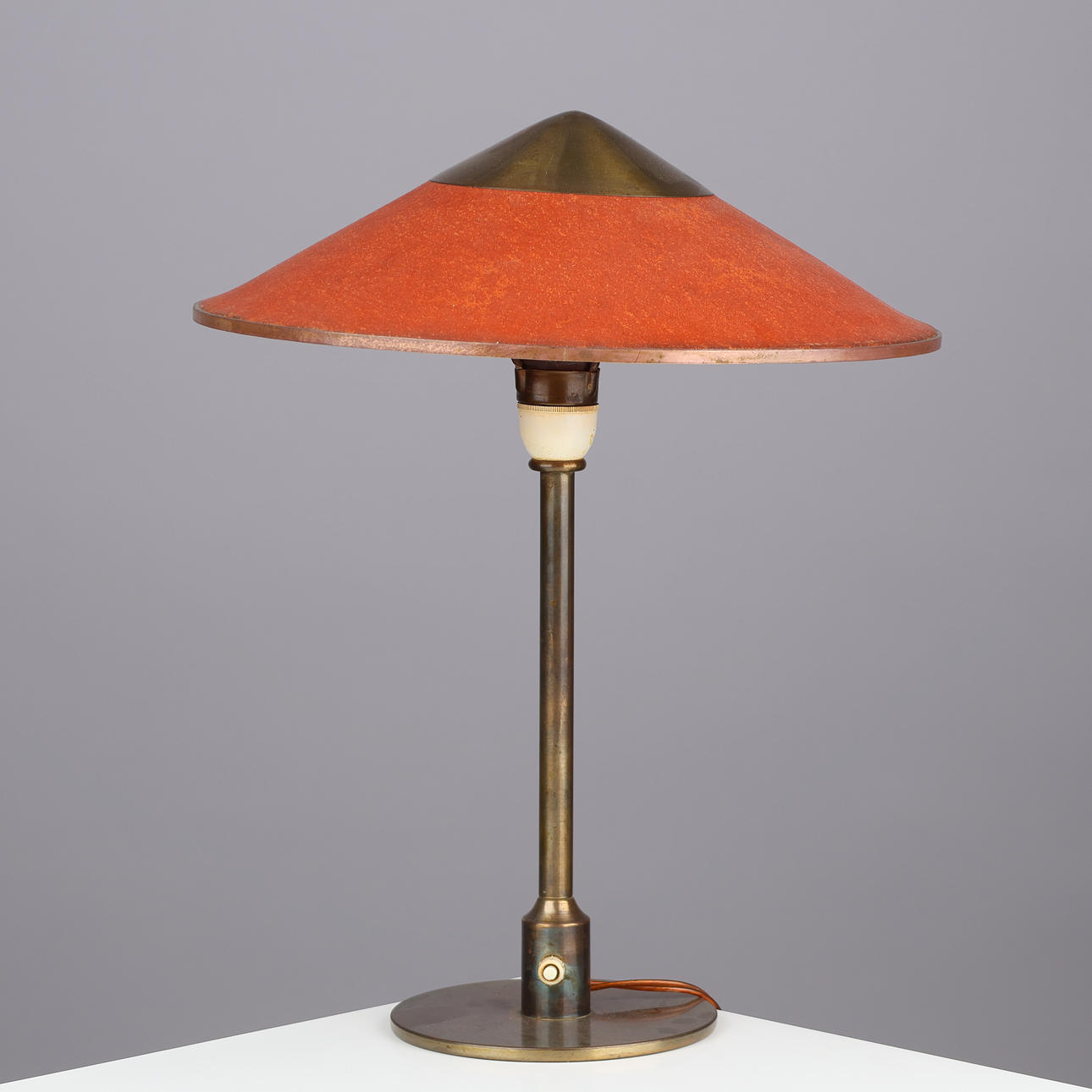 NIELS RASMUSSEN THYKIER (1883-1978). “Kongelys” brass table lamp with a ...