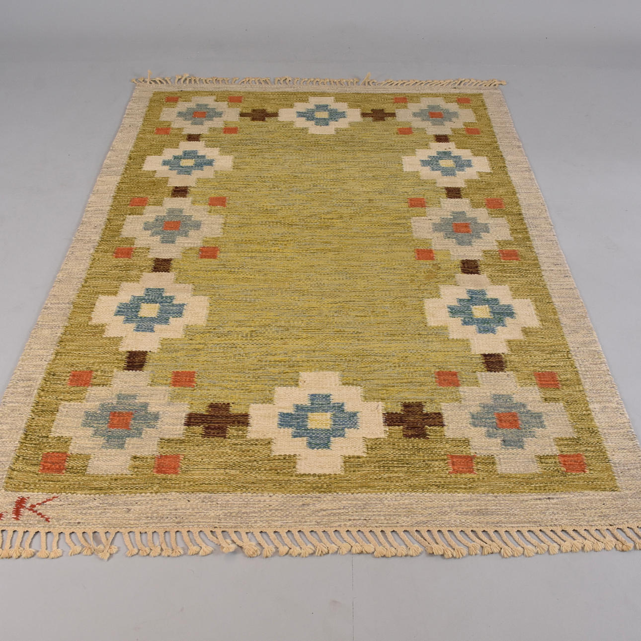 CARPET, wicker, signed LK.