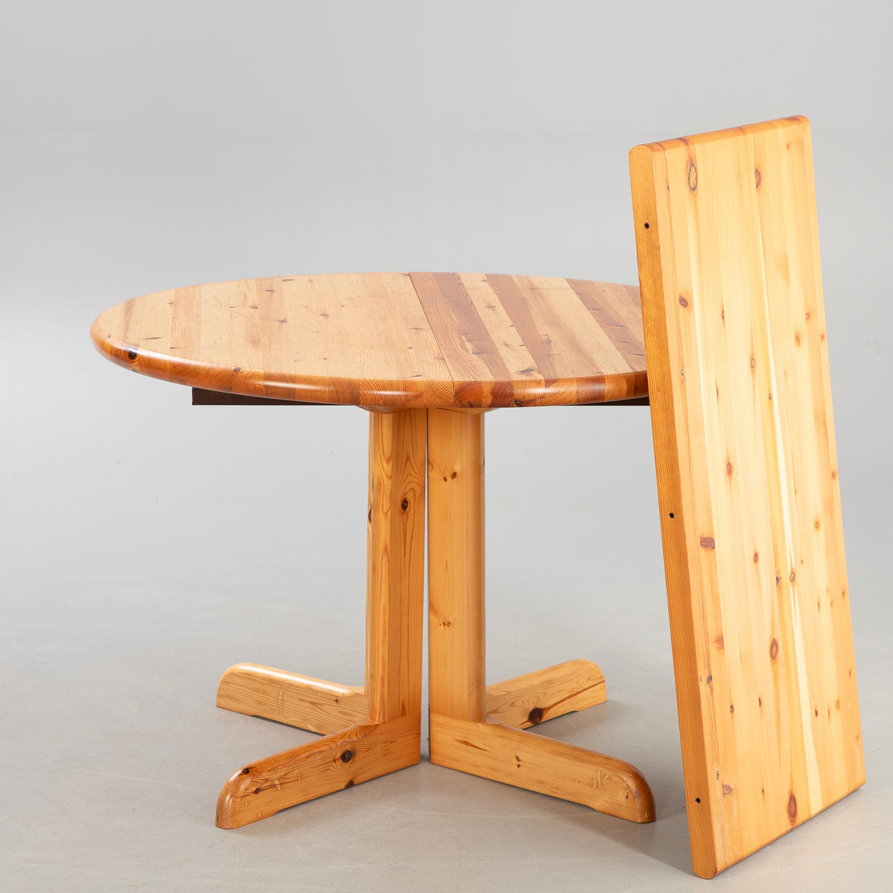 Extendable dining table with pine wood insert.