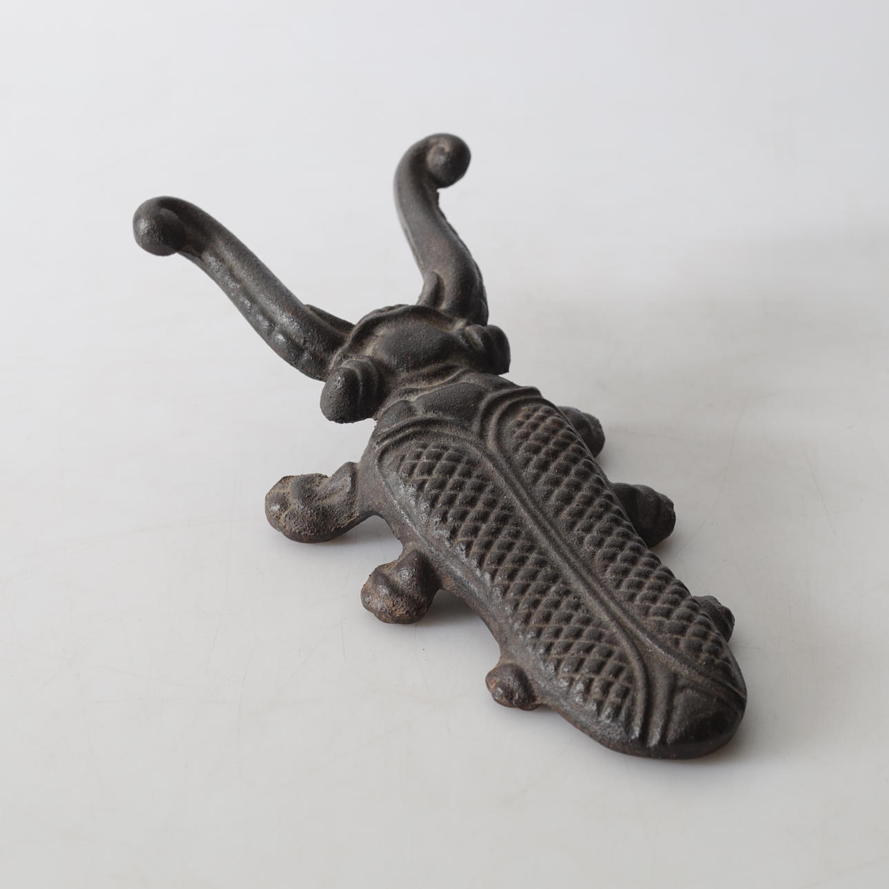 A cast-iron shoe rack, 20th century.